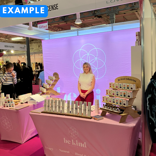 Woman standing behind a table with 'be kind' products at the Gifted event in RDS in Dublin 4