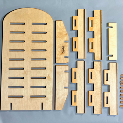 Set of wooden architectural models on a gray background