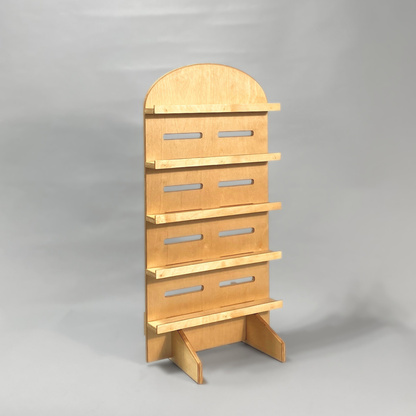 Wooden jewellery display rack on a gray background