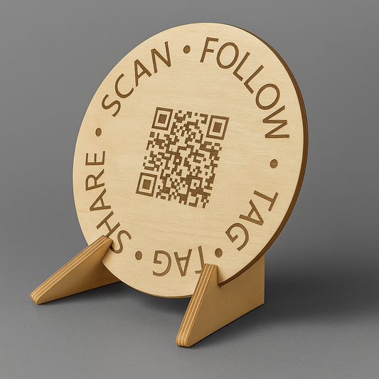 Wooden circular sign with QR code and text on a stand against a gray background